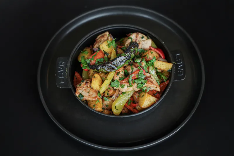 Archived photograph of a chicken-and-potatoes meal